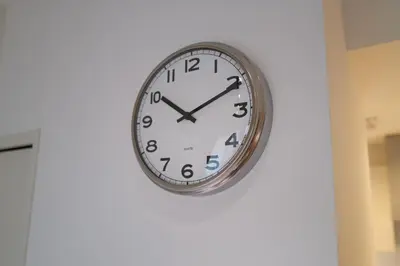 a clock is hanging on a wall at Regnocomfort Asakusa 3 - Vacation STAY 61882v in Tokyo
