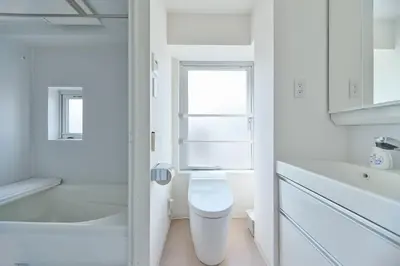a white bathroom with a toilet and a window at Regnocomfort Asakusa 3 - Vacation STAY 61882v in Tokyo