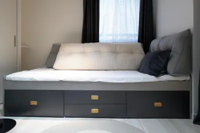 a bed with a white mattress and a window at Regnocomfort Asakusa 3 - Vacation STAY 57915v in Tokyo
