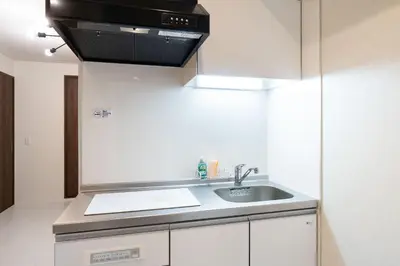 a kitchen with a sink and a microwave at \u30e9\u30a6\u30ec\u30a2\u30bf\u30ef\u30fc\u6c60\u888b in Tokyo