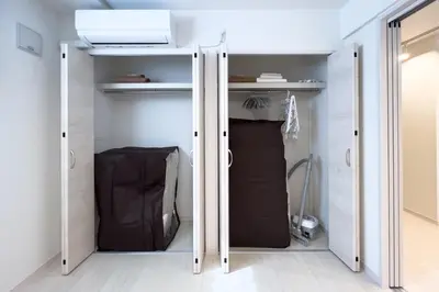 a walk in closet with a door open at toggle BUNKYO KORAKUEN in Tokyo