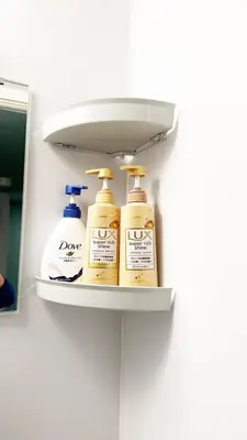 four bottles of moisturizers sit on a shelf in a bathroom at Hananosato Hotel \u6c60\u888b\u672c\u5e97 in Tokyo