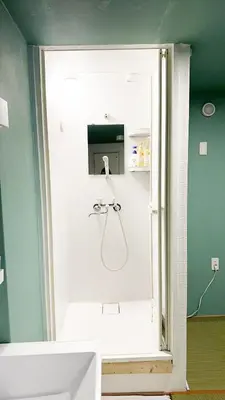 a bathroom with a shower and a sink at Hananosato Hotel \u6c60\u888b\u672c\u5e97 in Tokyo