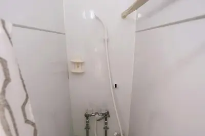a bathroom with a shower with a toilet in it at Momo House Near Komagome easy to shinjuku, Ueno, Tokyo in Tokyo