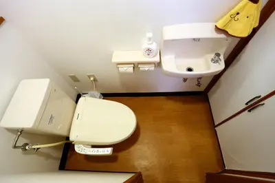 a bathroom with a toilet and a sink at Momo House Near Komagome easy to shinjuku, Ueno, Tokyo in Tokyo
