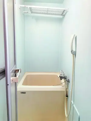 a bath tub in a bathroom with a shower at Momo House Near Komagome easy to shinjuku, Ueno, Tokyo in Tokyo
