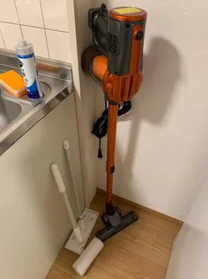 a hair drier in the corner of a kitchen at Compact 2DK in west Shinjuku in Tokyo