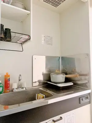 a kitchen with a sink and a counter at Central Shinjuku/Shinjukukicho/JR Shinuku Station 3 min' walk/新宿中心 新宿歌舞伎/912 in Tokyo
