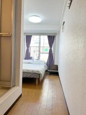 a bedroom with a bed and a window at Central Shinjuku/Shinjukukicho/JR Shinuku Station 3 min' walk/新宿中心 新宿歌舞伎/912 in Tokyo