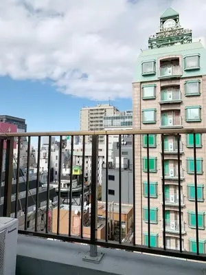 a balcony with a view of a building at Central Shinjuku/Shinjukukicho/JR Shinuku Station 3 min' walk/新宿中心 新宿歌舞伎/912 in Tokyo