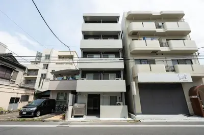 a building with a van parked in front of it at Felice\u68ee\u4e0b in Tokyo