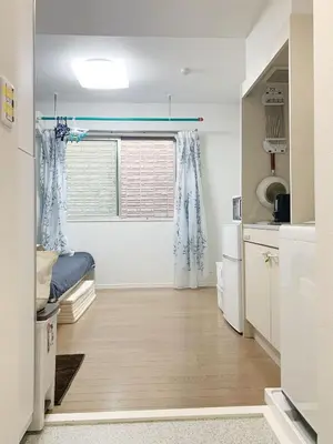 a small kitchen with a bed and a window at JR t akadababa subway 5 mins walk! Newly building \u65b0\u7bc9! \u9ad8\u7530\u99ac\u5834\u99c5 \u5f92\u6b69\u570f\u5185\u5927\u4eba\u6c17! Shinjuku\u65b0\u5bbf\u5708!\u9ad8\u901f\u65e0\u9650\u5236Wi-FI! B2 in Tokyo