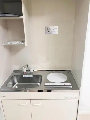 a small kitchen with a sink and a counter top at JR t akadababa subway 5 mins walk! Newly building \u65b0\u7bc9! \u9ad8\u7530\u99ac\u5834\u99c5 \u5f92\u6b69\u570f\u5185\u5927\u4eba\u6c17! Shinjuku\u65b0\u5bbf\u5708!\u9ad8\u901f\u65e0\u9650\u5236Wi-FI C2 in Tokyo