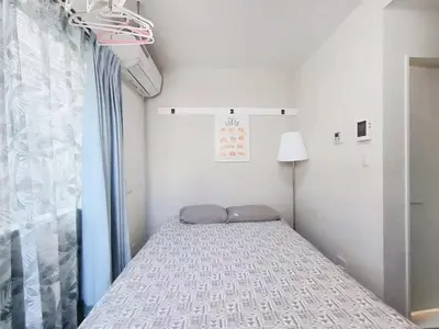 a small bedroom with a bed in a room at JR t akadababa subway 5 mins walk! Newly building \u65b0\u7bc9! \u9ad8\u7530\u99ac\u5834\u99c5 \u5f92\u6b69\u570f\u5185\u5927\u4eba\u6c17! Shinjuku\u65b0\u5bbf\u5708!\u9ad8\u901f\u65e0\u9650\u5236Wi-FI C1 in Tokyo