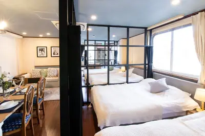 a bedroom with two bunk beds and a dining room at 【5/24NEW OPEN】浅草徒歩3分/Max9名/無料駐車場/渋谷直通 in Tokyo