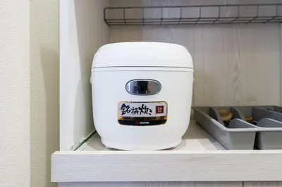 a white water cooler sitting on a shelf at ANGO Shibuya I in Tokyo