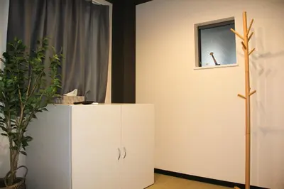 a white cabinet in a room with a mirror at Tokyo Asakusa New Condo Sensoji-6min in Tokyo