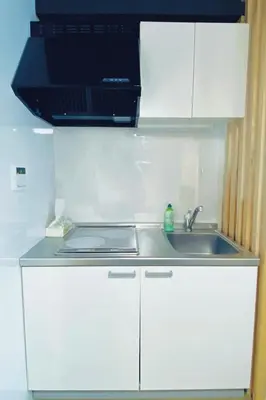 a white kitchen with a sink and a microwave at Tokyo Asakusa New Condo Sensoji-6min in Tokyo