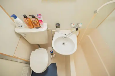 a bathroom with a toilet and a sink at New Design Apartment in Shinjuku Kabukicho! 3 mins station in Tokyo
