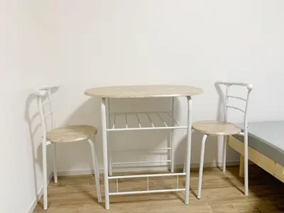 two chairs and a table and two stools at Shinjuku \u65b0\u5bbf\u5f92\u6b65\u5708!\u897f\u65b0\u5bbf!\u90fd\u5385!\u65b0\u5bbf\u4e2d\u592e\u516c\u56ed!2\u5206\u949f\u6b65\u884c\u5230\u5730\u94c1!\u9ad8\u901f\u65e0\u9650\u5236\u7f51\u7edc!\u7cbe\u81f4\u516c\u5bd3Autolock!104 in Tokyo