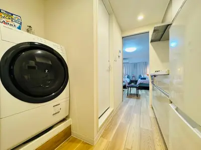 a washer and dryer in a room with a hallway at Shinjuku-Kabukicho-SJ0012 in Tokyo