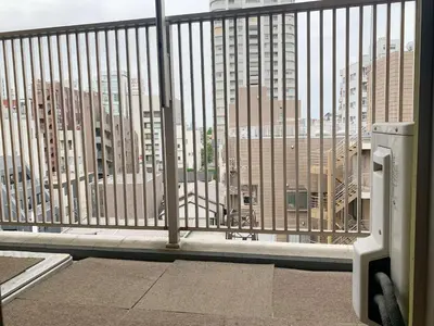 a balcony with a view of a city with tall buildings at Ikebukuro Center! Ikebukuro 6min walk! \u6c60\u888b\u4e2d\u5fc3\u5730\u5e26! \u6c60\u888b\u8f66\u7ad9\u6b65\u884c6\u5206! \u516c\u5bd3\u5e72\u6e7f\u5206\u79bb! \u667a\u80fd\u9a6c\u6876! \u9ad8\u901f\u65e0\u9650\u5236\u7f51\u8def!603 in Tokyo