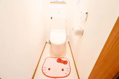 a bathroom with a toilet with a hello kitty sign on the floor at Ikebukuro Center! Ikebukuro 6min walk!\u6c60\u888b\u4e2d\u5fc3\u5730\u5e26! \u6c60\u888b\u8f66\u7ad9\u6b65\u884c6\u5206!loft\u9601\u697c!\u516c\u5bd3\u5e72\u6e7f\u5206\u79bb! \u667a\u80fd\u9a6c\u6876! \u9ad8\u901f\u65e0\u9650\u5236\u7f51\u8def! 103 in Tokyo