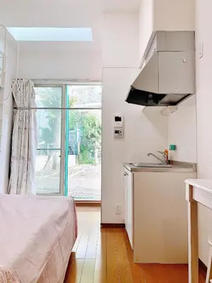 a kitchen with a bed and a sink in a room at Ikebukuro Center! Ikebukuro 6min walk!\u6c60\u888b\u4e2d\u5fc3\u5730\u5e26! \u6c60\u888b\u8f66\u7ad9\u6b65\u884c6\u5206!loft\u9601\u697c!\u516c\u5bd3\u5e72\u6e7f\u5206\u79bb! \u667a\u80fd\u9a6c\u6876! \u9ad8\u901f\u65e0\u9650\u5236\u7f51\u8def! 103 in Tokyo