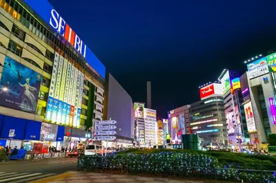a busy city street at night with many buildings at Ikebukuro Center! Ikebukuro 6min walk!\u6c60\u888b\u4e2d\u5fc3\u5730\u5e26! \u6c60\u888b\u8f66\u7ad9\u6b65\u884c6\u5206!loft\u9601\u697c!\u516c\u5bd3\u5e72\u6e7f\u5206\u79bb! \u667a\u80fd\u9a6c\u6876! \u9ad8\u901f\u65e0\u9650\u5236\u7f51\u8def! 103 in Tokyo