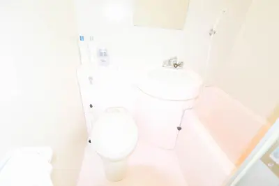 a white bathroom with a toilet and a sink at Ikebukuro Center# Ikebukuro 9min walk#\u6c60\u888b\u4e2d\u5fc3\u5730\u5e26# \u6c60\u888b\u8f66\u7ad9\u6b65\u884c9\u5206# \u9ad8\u901f\u65e0\u9650\u5236WIFI #\u8bbe\u65bd\u9f50\u5168 \u5b89\u9759\u6574\u6d01201 in Tokyo