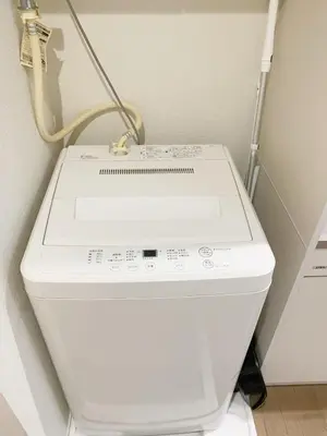 a white washing machine sitting in a room at \u9ad8\u7530\u99ac\u5834 T akadababa subway, 5-Minute Walk from New room BC in Tokyo