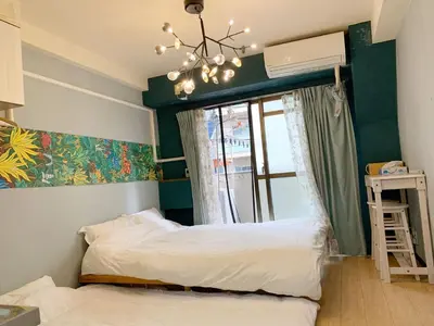 a bedroom with a bed and a window and a chandelier at Shinjuku Area!Nishi-Shinjuku Gochome subway 6 minutes walk! \u897f\u65b0\u5bbf\u4e94\u4e01\u76ee\u8f66\u7ad9\u6b65\u884c6\u5206\u949f! \u9ad8\u901f\u65e0\u9650\u5236WIFI 201 in Tokyo