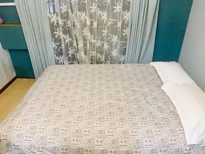 a bed in a room with a bed sidx sidx sidx at Shinjuku Area!Nishi-Shinjuku Gochome subway 6 minutes walk! \u897f\u65b0\u5bbf\u4e94\u4e01\u76ee\u8f66\u7ad9\u6b65\u884c6\u5206\u949f! \u9ad8\u901f\u65e0\u9650\u5236WIFI 201 in Tokyo