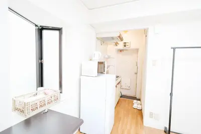 a kitchen with a refrigerator and a window at Shinjuku Area/Nishi-Shinjuku Gochome subway 6 minutes walk/西新宿五丁目车站步行6分钟 211 in Tokyo