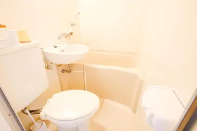a white bathroom with a toilet and a sink at Shinjuku Area/Nishi-Shinjuku Gochome subway 6 minutes walk/西新宿五丁目车站步行6分钟 211 in Tokyo