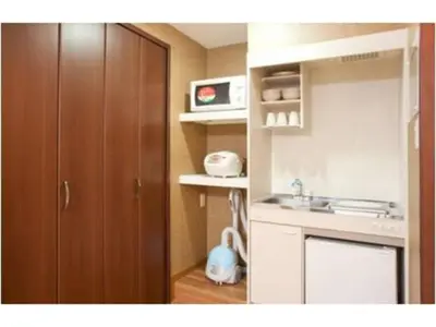 a kitchen with a sink and a wooden cabinet at Hotel Hanabi - Vacation STAY 67144v in Tokyo