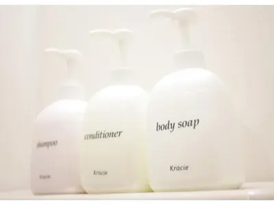 four white bottles of laundry detergent on a shelf at Hotel Hanabi - Vacation STAY 67139v in Tokyo