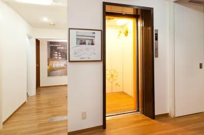 a hallway with a door and a picture on a wall at Hotel Hanabi - Vacation STAY 62608v in Tokyo