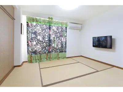 a room with a painting on the wall and a curtain at Hotel Hanabi - Vacation STAY 67110v in Tokyo