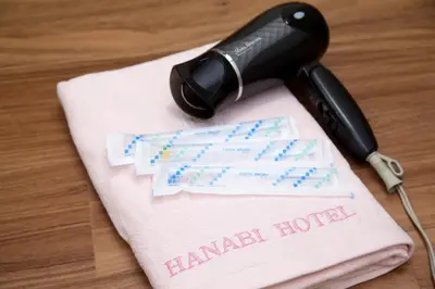 a phone on top of a napkin with a haram hotel at Hotel Hanabi - Vacation STAY 67110v in Tokyo