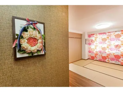 a room with a painting of flowers on the wall at Hotel Hanabi - Vacation STAY 67133v in Tokyo