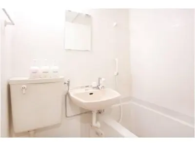 a white bathroom with a sink and a bath tub at Hotel Hanabi - Vacation STAY 67133v in Tokyo