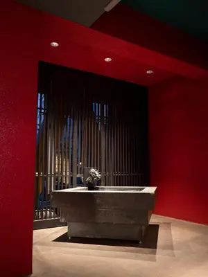 a red room with a large sink in the middle at ELE Cabin Shinjuku Kabukicho in Tokyo