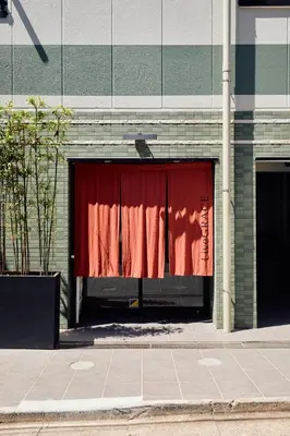 a red curtain is in a building at LiveGRACE Mabuji Park Hotel - Vacation STAY 51973v in Tokyo
