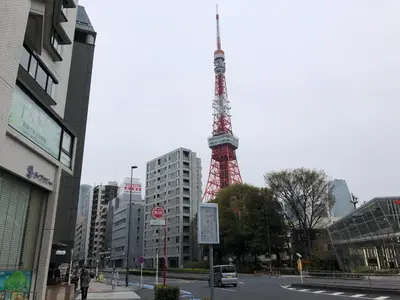 a red and white tower in the middle of a city at LiveGRACE Mabuji Park Hotel - Vacation STAY 51973v in Tokyo