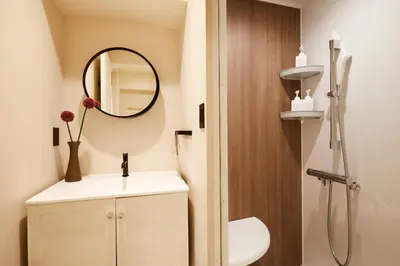 a bathroom with a sink and a mirror at LiveGRACE Mabuji Park Hotel - Vacation STAY 51973v in Tokyo