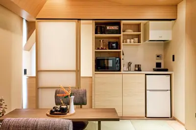 a kitchen with a table and a microwave at LiveGRACE Mabuji Park Hotel - Vacation STAY 51973v in Tokyo