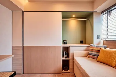 a living room with a couch and a window at LiveGRACE Mabuji Park Hotel - Vacation STAY 51799v in Tokyo