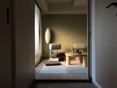 a hallway with a table and a chair in a room at LiveGRACE Mabuji Park Hotel - Vacation STAY 51799v in Tokyo