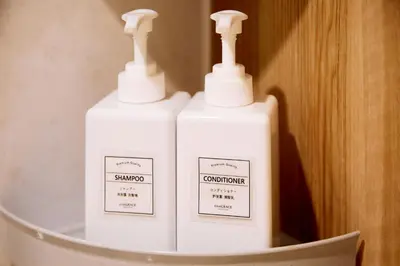 two white bottles ofodorizers sitting on a shelf at LiveGRACE Mabuji Park Hotel - Vacation STAY 51799v in Tokyo